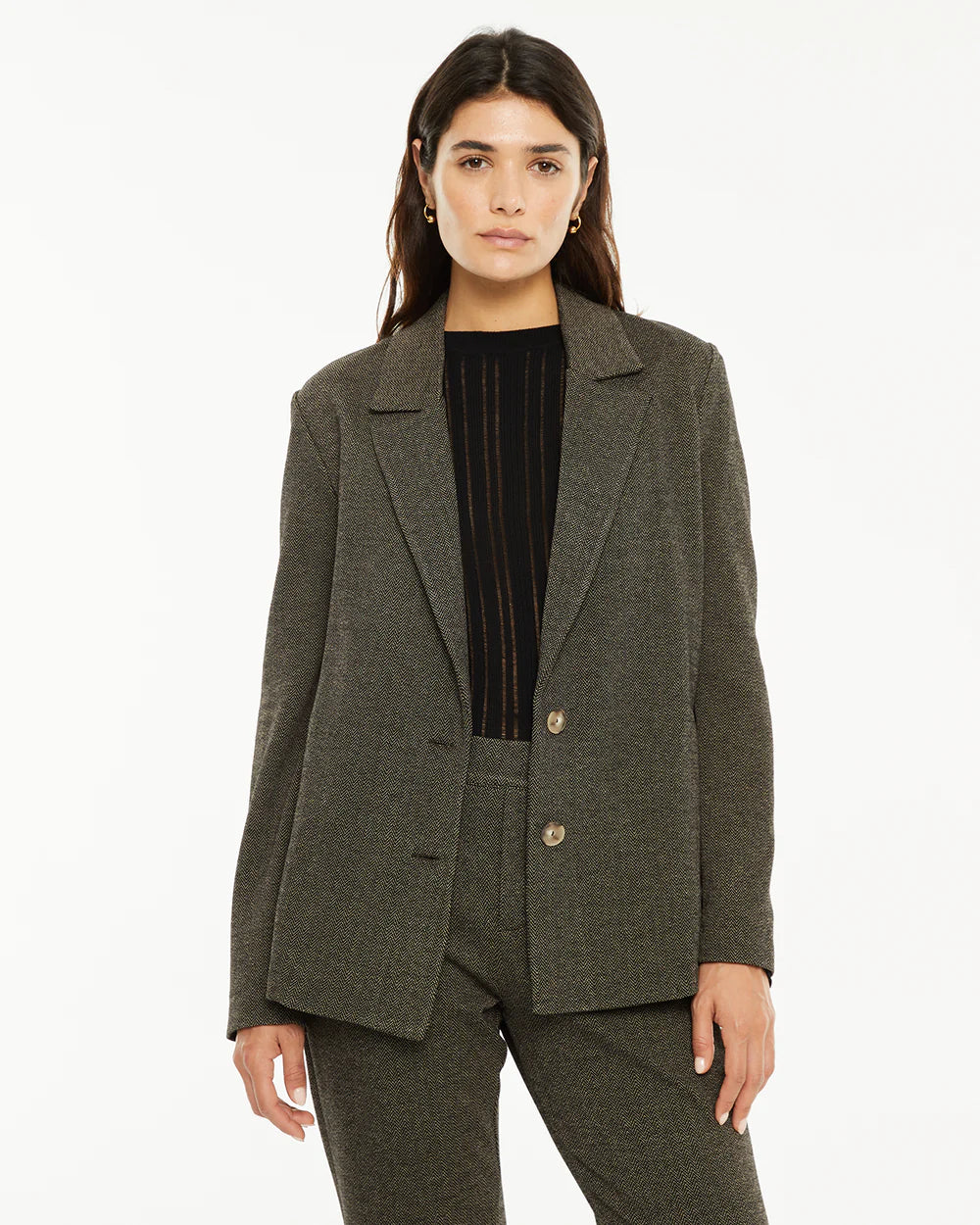 AMERICANA ELÁSTICA ESPIGA MARRÓN System Action